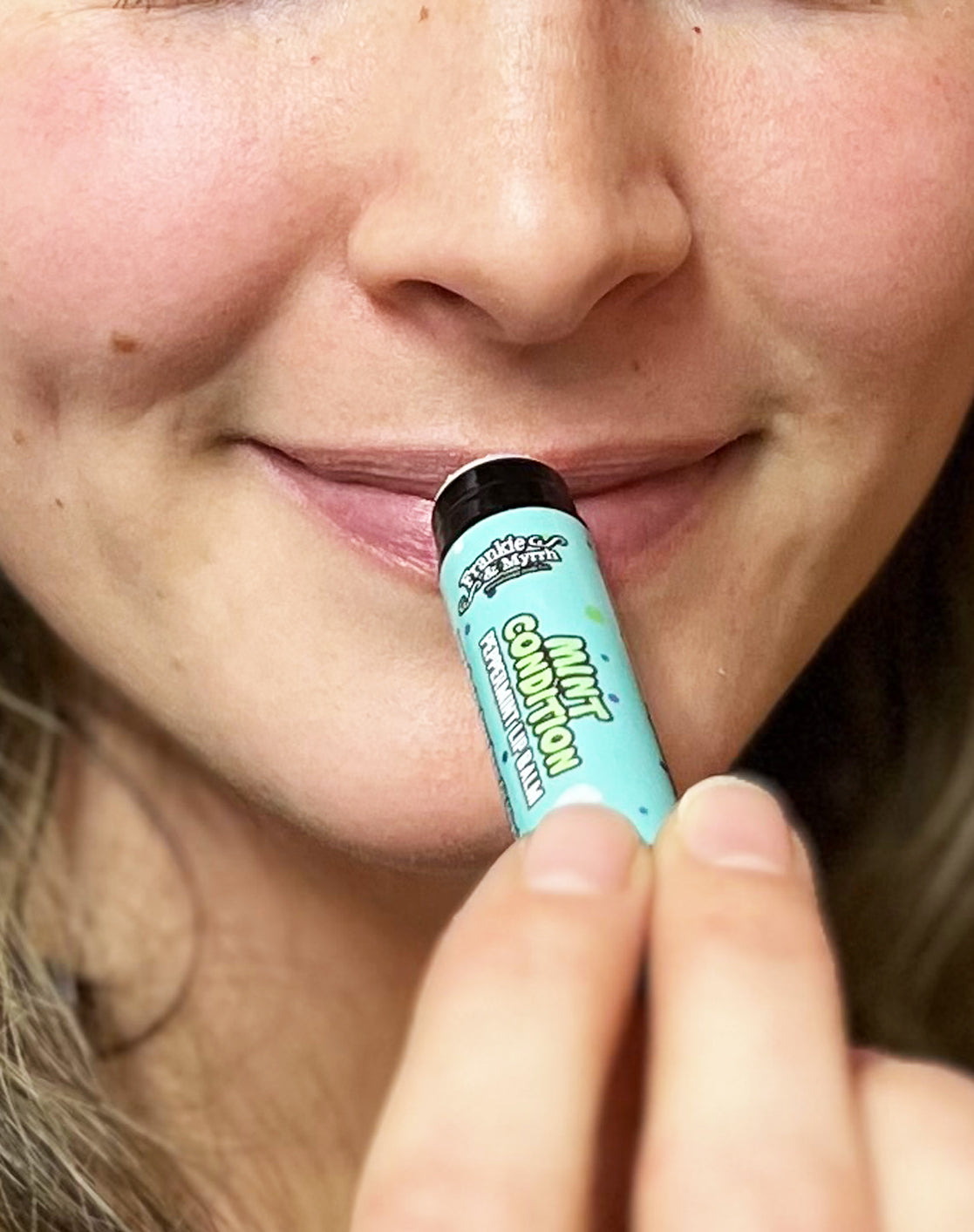 frankie and myrrh mint condition peppermint lip balm on lips